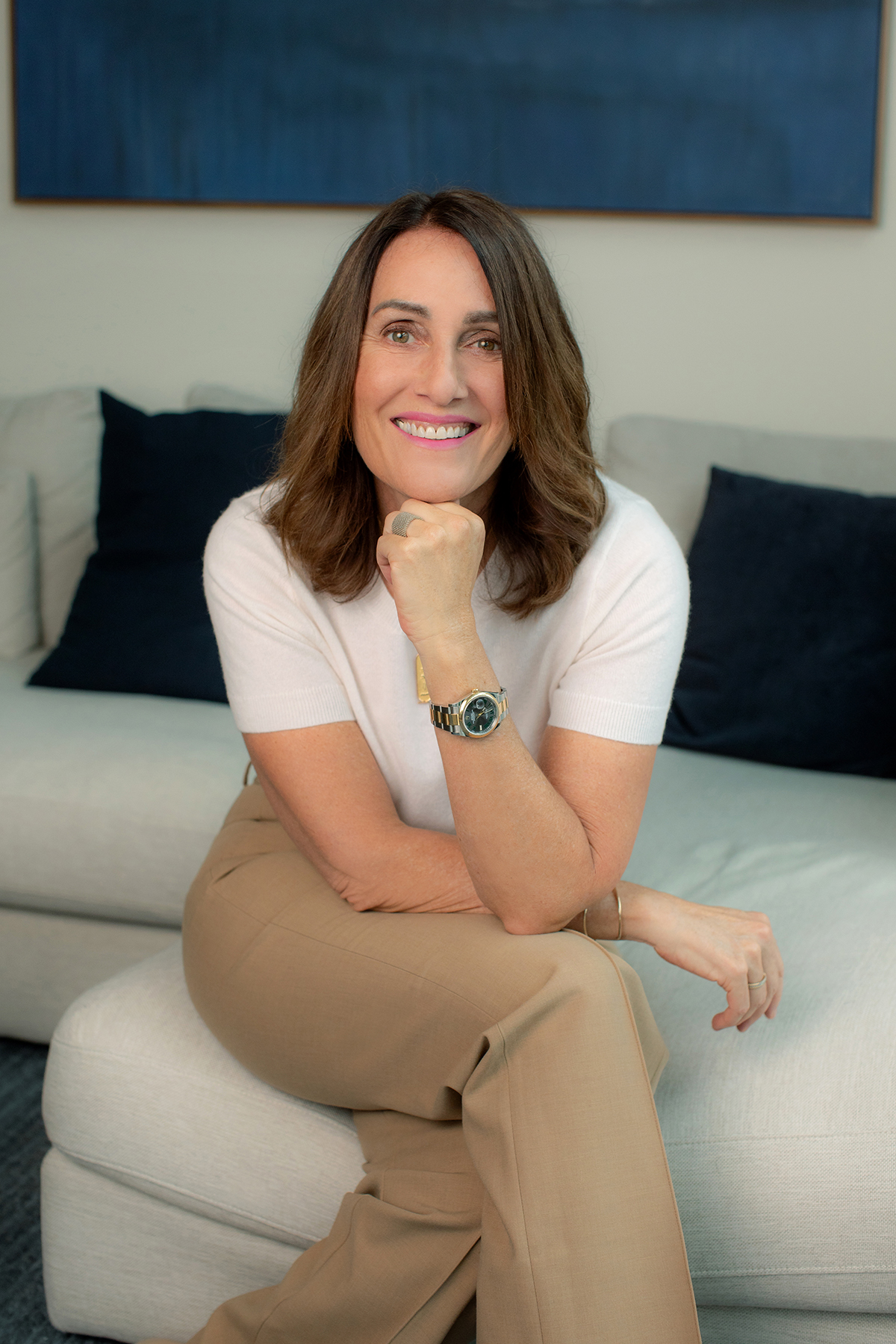 Ellen McGinnis, Life and Leadership Strategist, seated and smiling